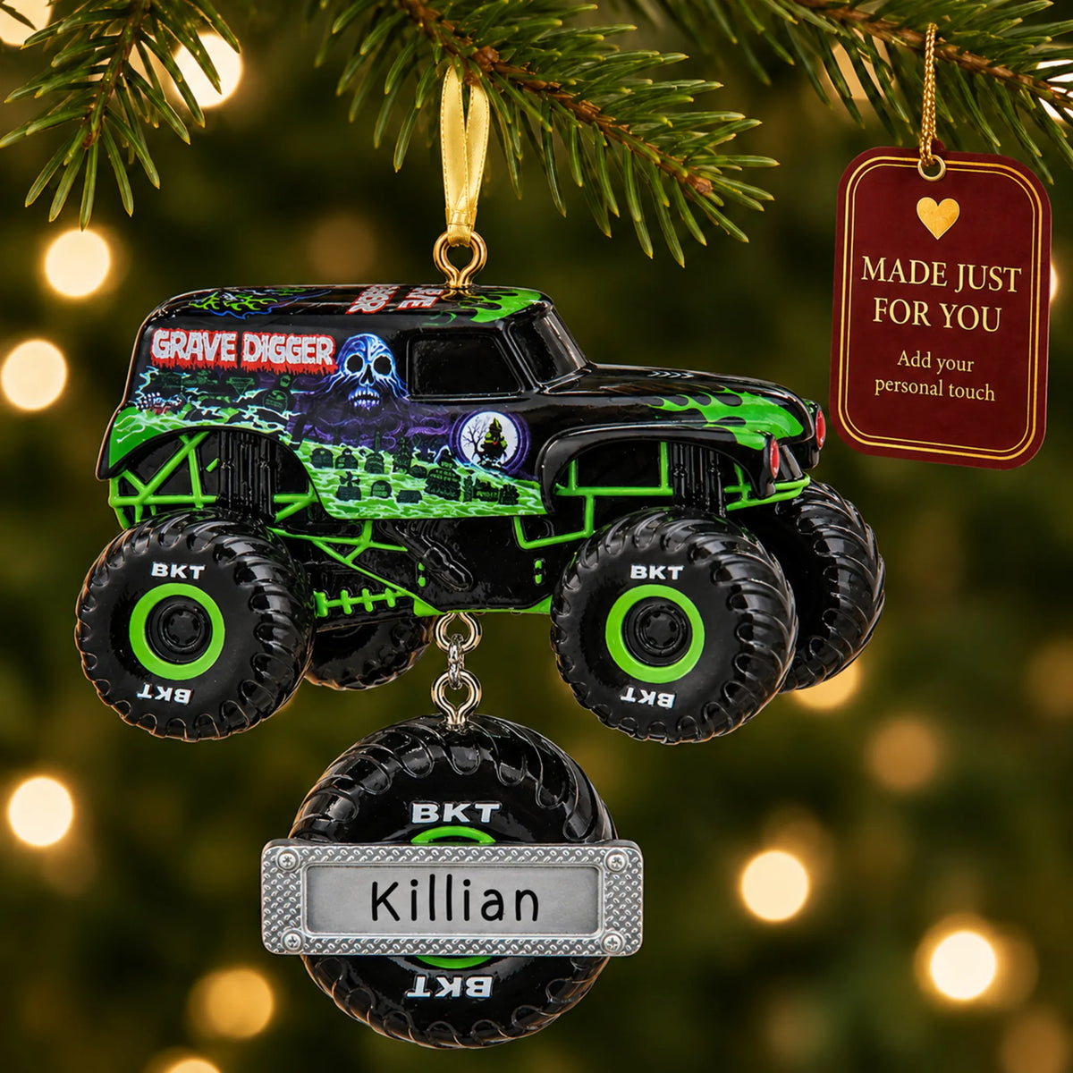 Grave Digger Monster Truck christmas ornament hanging on a lit Christmas tree with a Made Just For You gift tag