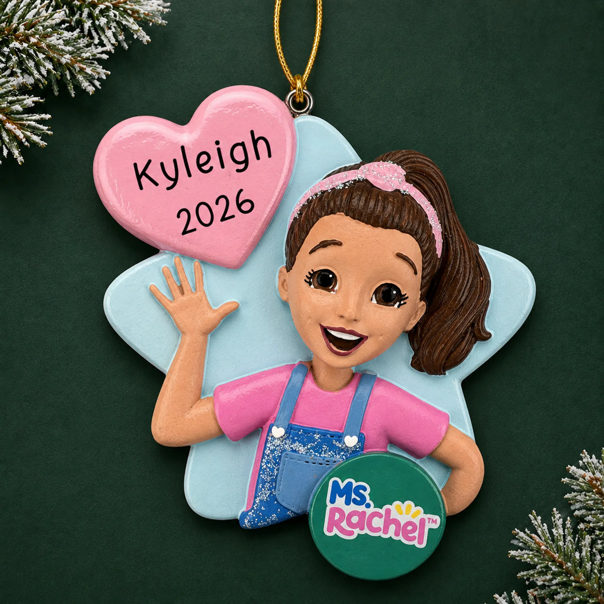 Personalized Ms. Rachel christmas ornament on a dark green pine background