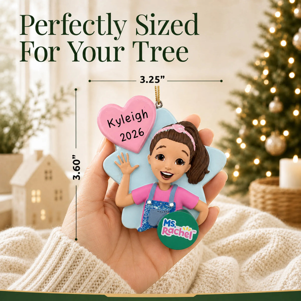 Size guide: the personalized Ms. Rachel christmas ornament shown in hand next to a Christmas tree