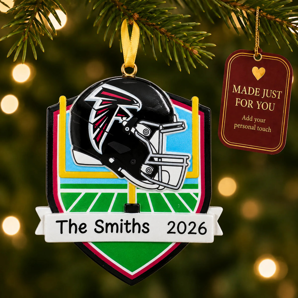 Atlanta Falcons NFL christmas ornament hanging on a lit Christmas tree with a Made Just For You gift tag