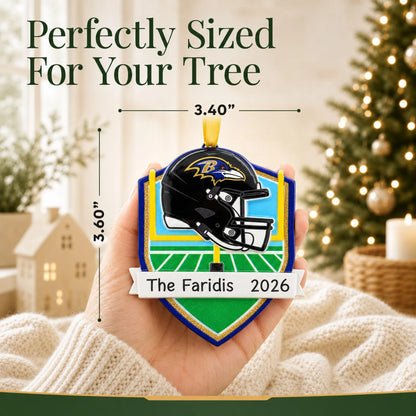 Size guide: the personalized Baltimore Ravens NFL christmas ornament is 3.40 in wide by 3.60 in tall, shown in hand