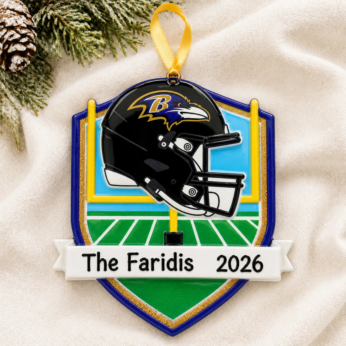 Personalized Baltimore Ravens NFL christmas ornament laid on a soft white knit blanket