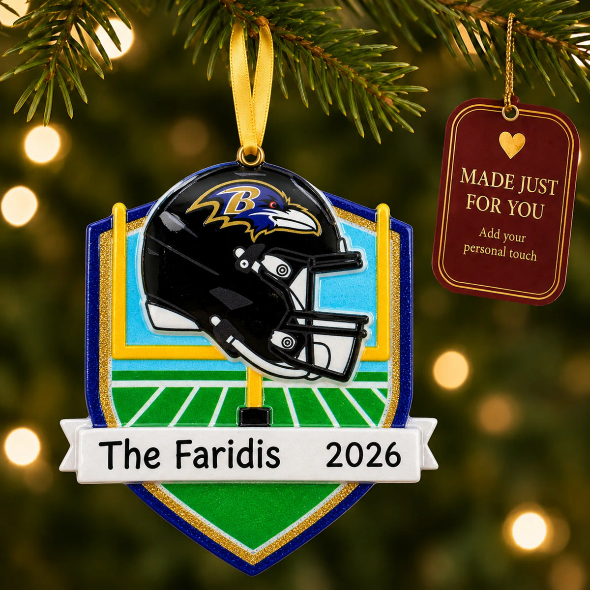 Baltimore Ravens NFL christmas ornament hanging on a lit Christmas tree with a Made Just For You gift tag