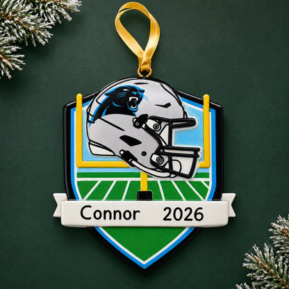 Personalized Carolina Panthers NFL christmas ornament on a dark green pine background