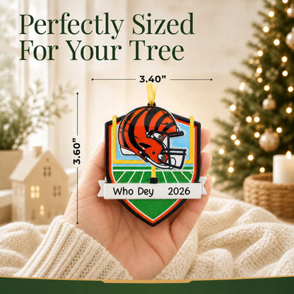 Size guide: the personalized Cincinnati Bengals NFL christmas ornament is 3.40 in wide by 3.60 in tall, shown in hand