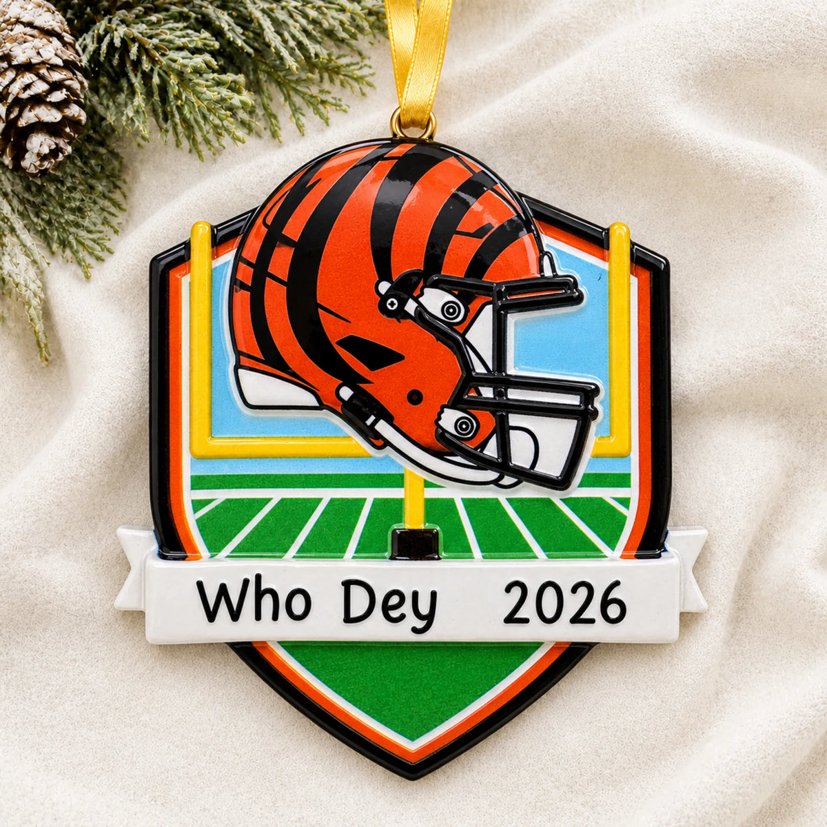 Personalized Cincinnati Bengals NFL christmas ornament laid on a soft white knit blanket