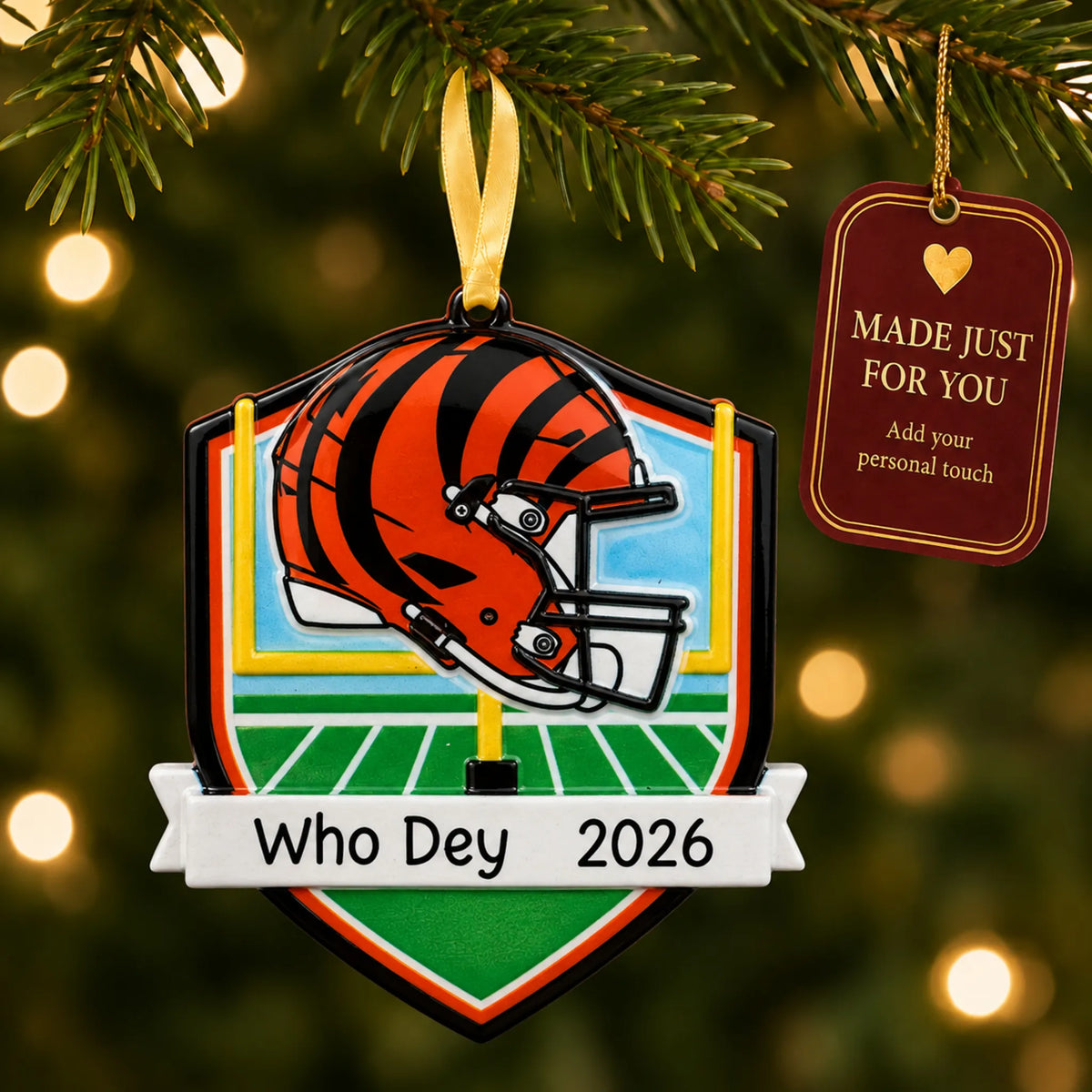 Cincinnati Bengals NFL christmas ornament hanging on a lit Christmas tree with a Made Just For You gift tag