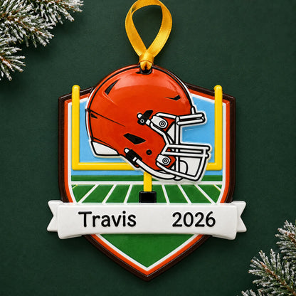 Personalized Cleveland Browns NFL christmas ornament on a dark green pine background