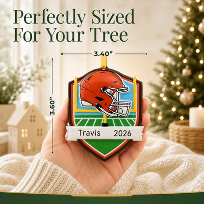 Size guide: the personalized Cleveland Browns NFL christmas ornament is 3.40 in wide by 3.60 in tall, shown in hand