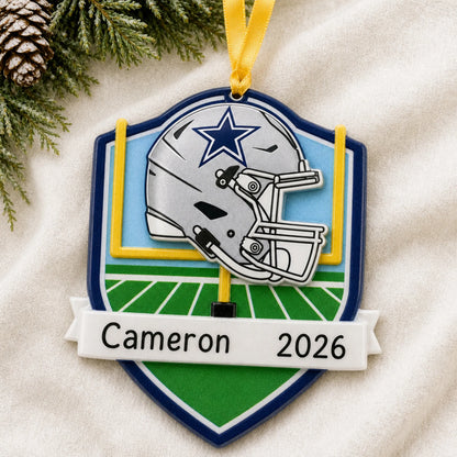 Personalized Dallas Cowboys NFL christmas ornament laid on a soft white knit blanket