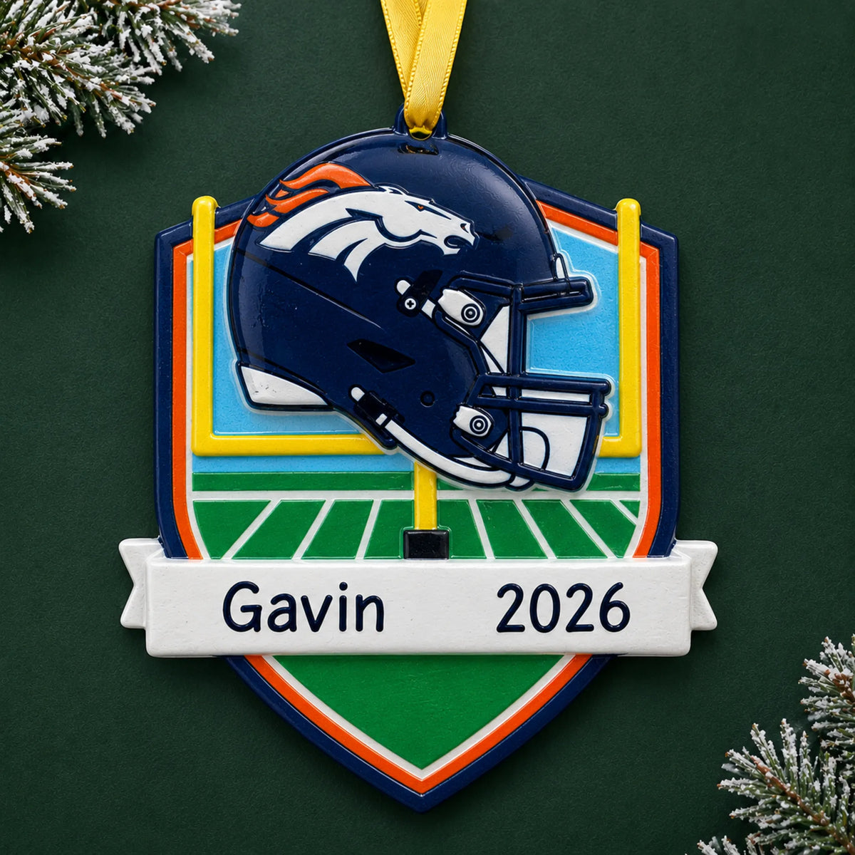 Personalized Denver Broncos NFL christmas ornament on a dark green pine background