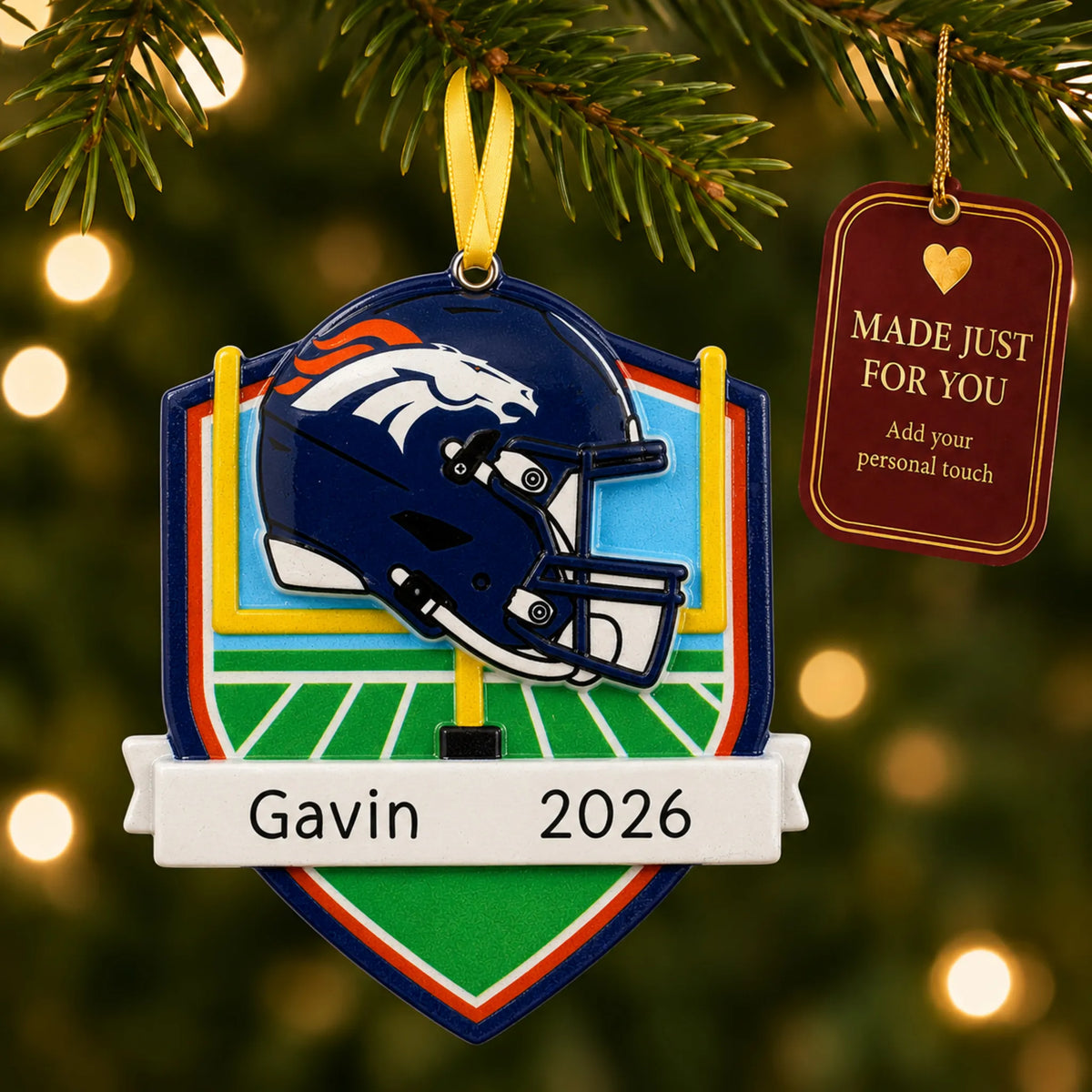 Denver Broncos NFL christmas ornament hanging on a lit Christmas tree with a Made Just For You gift tag