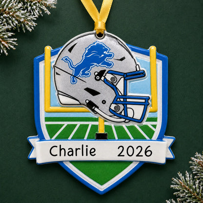 Personalized Detroit Lions NFL christmas ornament on a dark green pine background