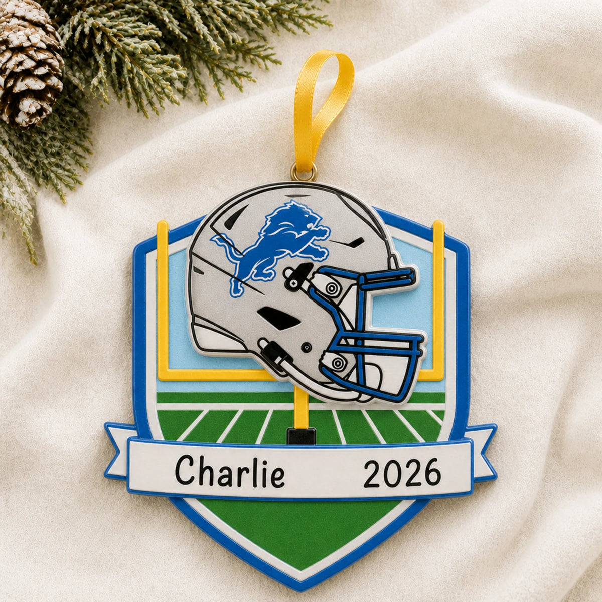 Personalized Detroit Lions NFL christmas ornament laid on a soft white knit blanket