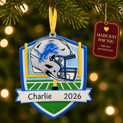 Detroit Lions NFL christmas ornament hanging on a lit Christmas tree with a Made Just For You gift tag