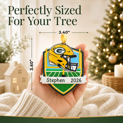 Size guide: the personalized Green Bay Packers NFL christmas ornament is 3.40 in wide by 3.60 in tall, shown in hand