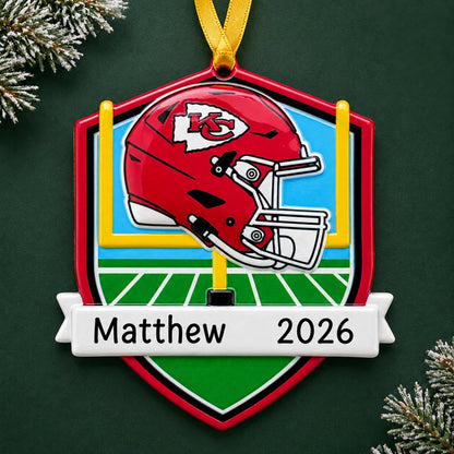 Personalized Kansas City Chiefs NFL christmas ornament on a dark green pine background