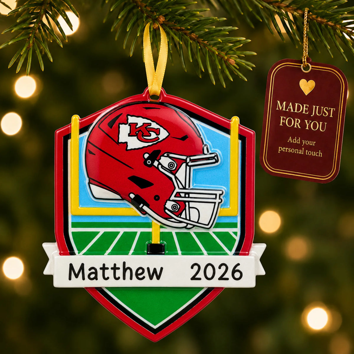 Kansas City Chiefs NFL christmas ornament hanging on a lit Christmas tree with a Made Just For You gift tag