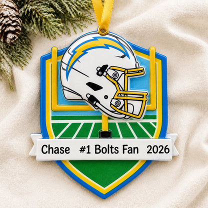Personalized Los Angeles Chargers NFL christmas ornament laid on a soft white knit blanket
