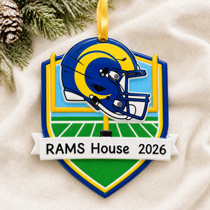 Personalized Los Angeles Rams NFL christmas ornament laid on a soft white knit blanket