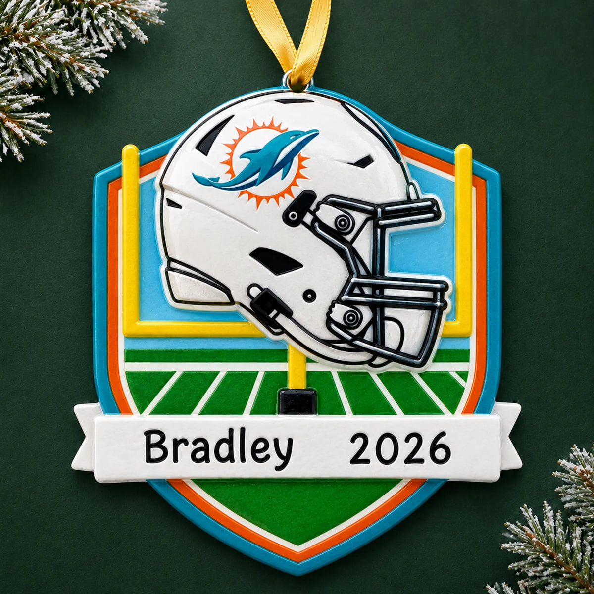 Personalized Miami Dolphins NFL christmas ornament on a dark green pine background