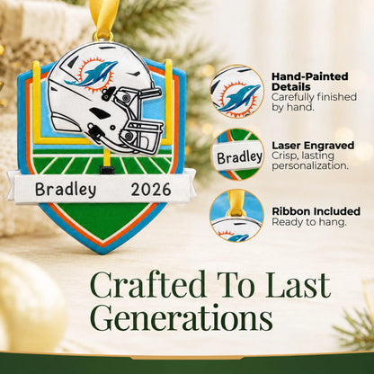 Hand-painted details and laser engraved personalization on the Miami Dolphins NFL christmas ornament, ribbon included
