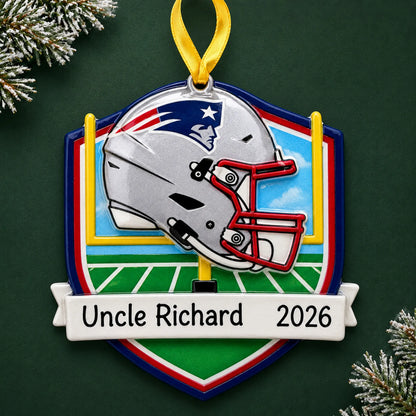 Personalized New England Patriots NFL christmas ornament on a dark green pine background