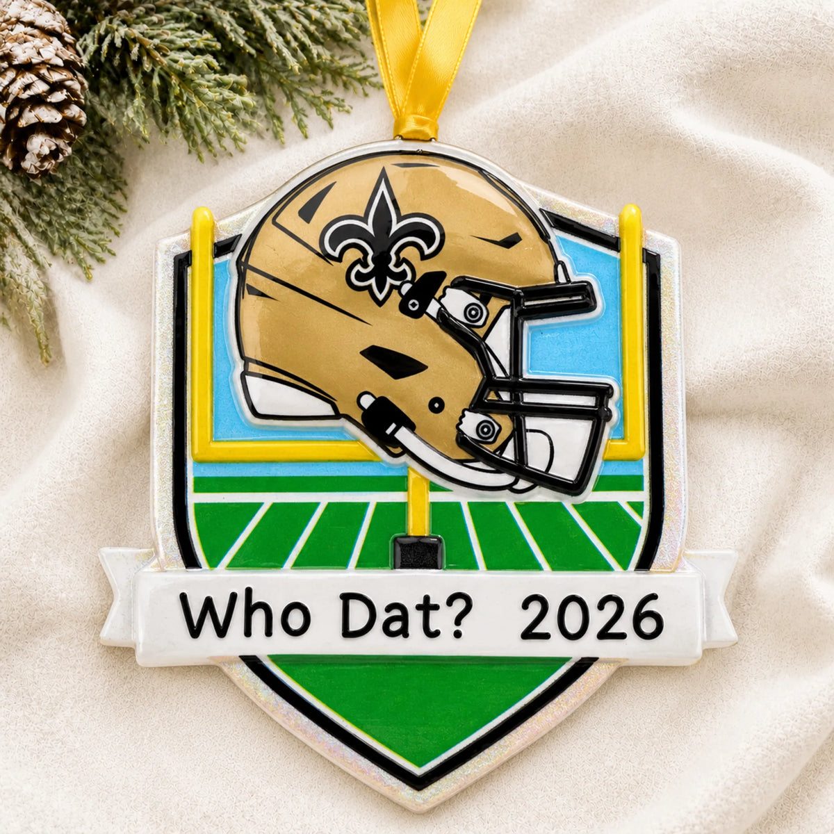 Personalized New Orleans Saints NFL christmas ornament laid on a soft white knit blanket