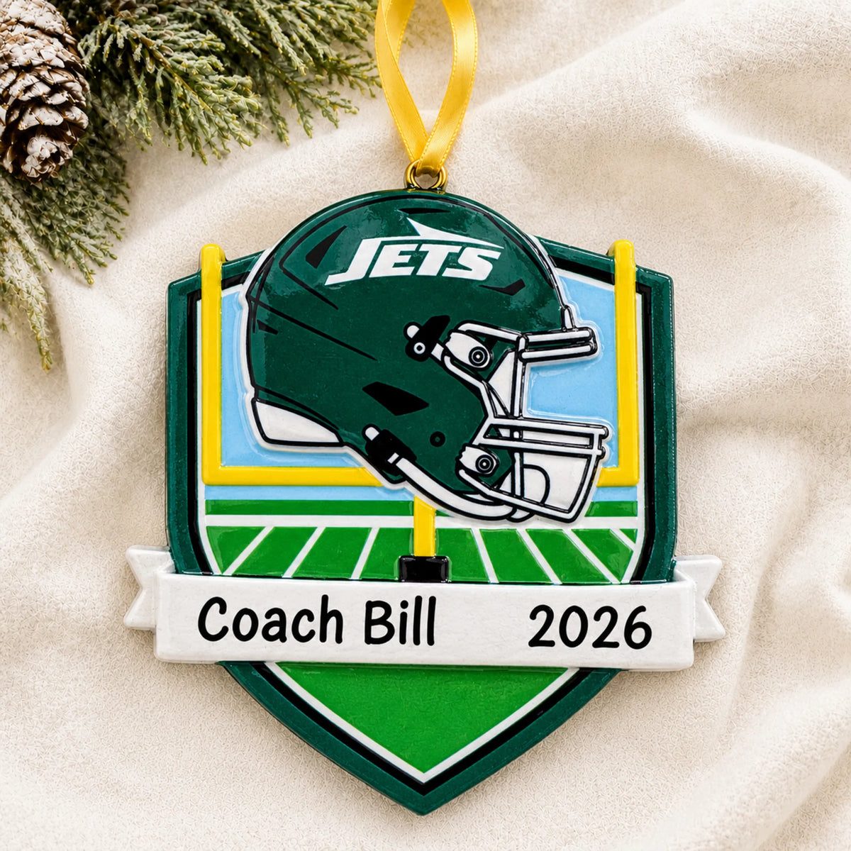 Personalized New York Jets NFL christmas ornament laid on a soft white knit blanket