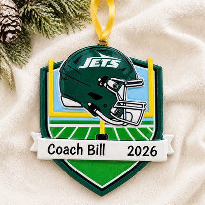 Personalized New York Jets NFL christmas ornament laid on a soft white knit blanket
