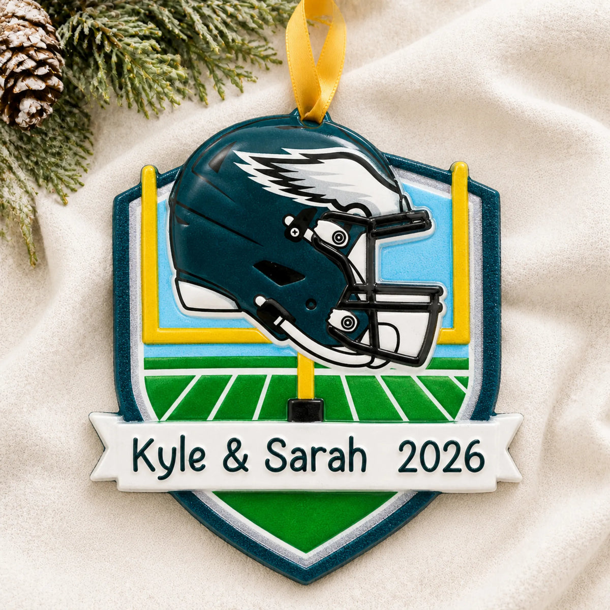 Personalized Philadelphia Eagles NFL christmas ornament laid on a soft white knit blanket