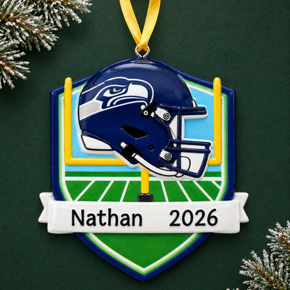 Personalized Seattle Seahawks NFL christmas ornament on a dark green pine background