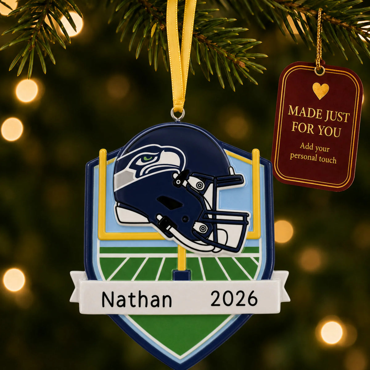 Seattle Seahawks NFL christmas ornament hanging on a lit Christmas tree with a Made Just For You gift tag