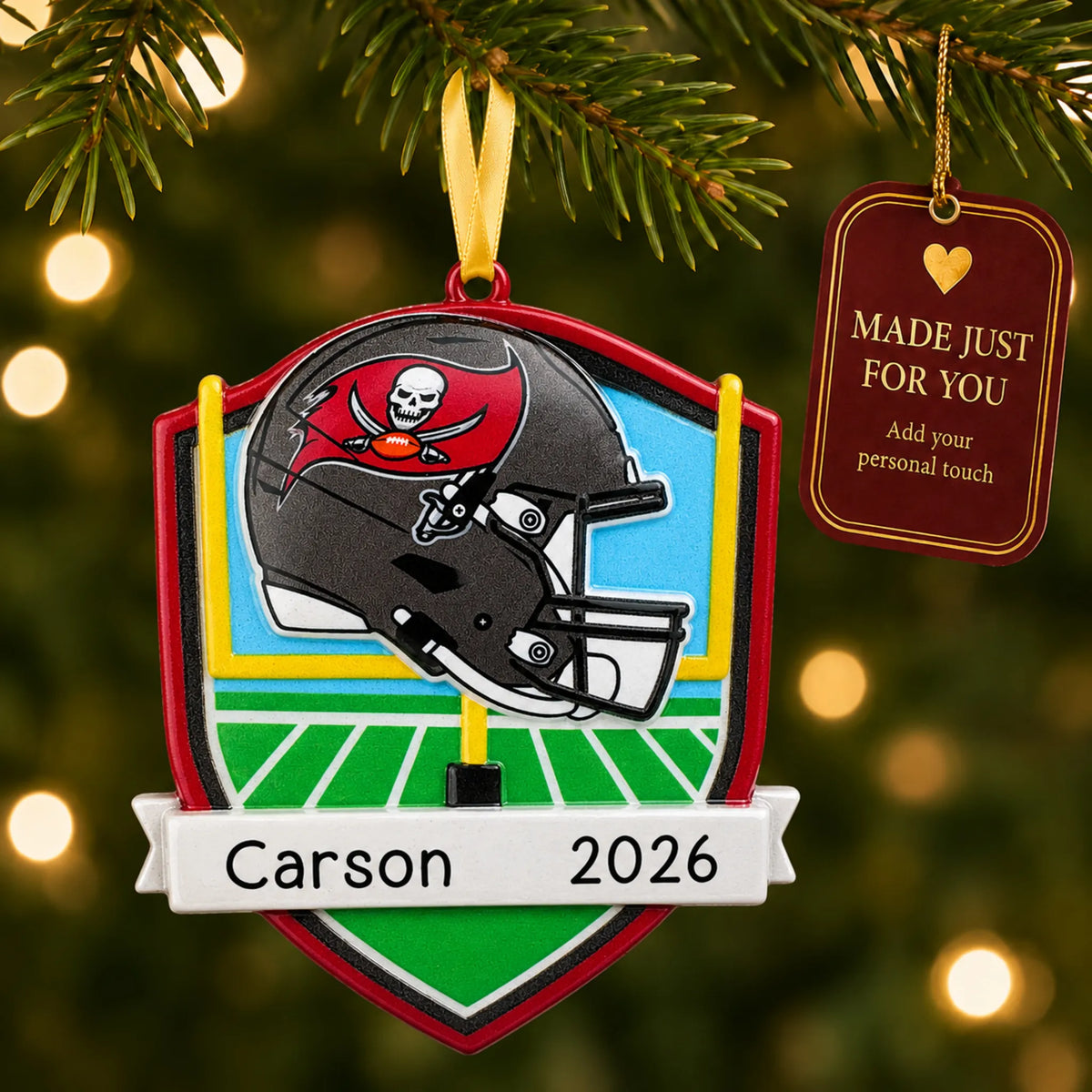 Tampa Bay Buccaneers NFL christmas ornament hanging on a lit Christmas tree with a Made Just For You gift tag