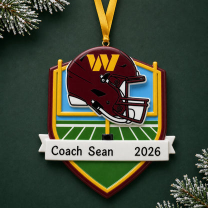 Personalized Washington Commanders NFL christmas ornament on a dark green pine background