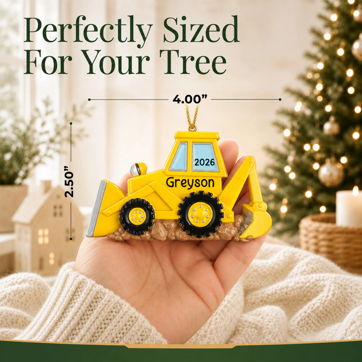 Size guide: the personalized backhoe christmas ornament is 4.00 in wide by 2.50 in tall, shown in hand