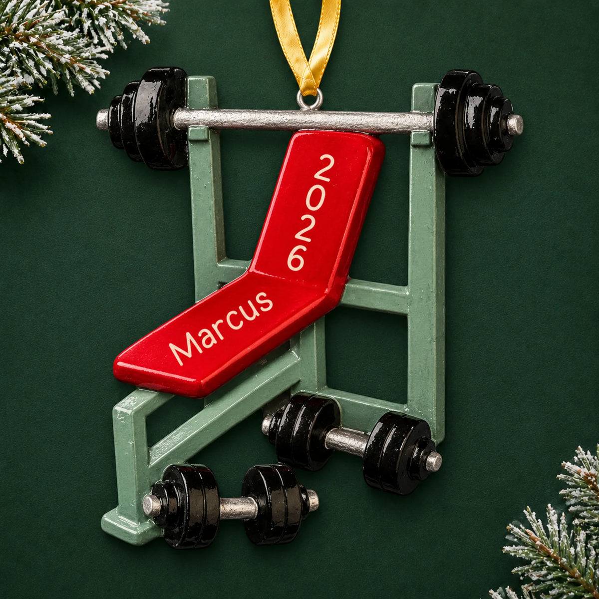 Personalized weight lifting bench christmas ornament on a dark green pine background