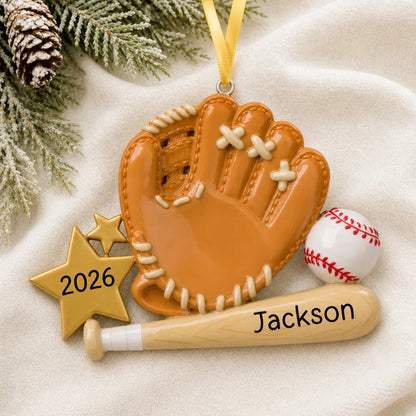 Personalized baseball bat, glove and ball christmas ornament laid on a soft white knit blanket