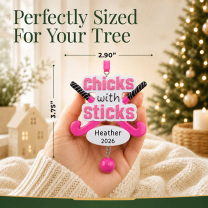 Size guide: the personalized field hockey christmas ornament shown in hand next to a Christmas tree
