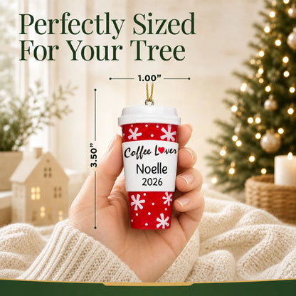 Size guide: the personalized Coffee Lover Cup christmas ornament is 1.00 in wide by 3.50 in tall, shown in hand