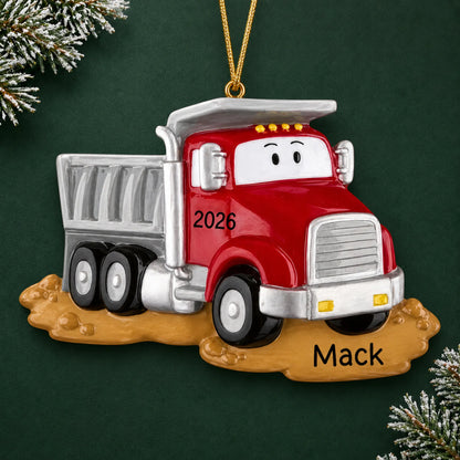 Personalized construction dump truck christmas ornament on a dark green pine background