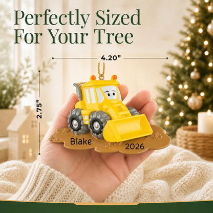 Size guide: the personalized bulldozer christmas ornament is 4.20 in wide by 2.75 in tall, shown in hand