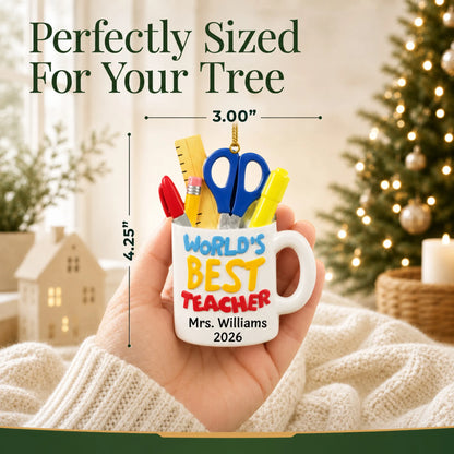 Personalized World's Best Teacher mug Christmas ornament held in hand to show its size on the tree