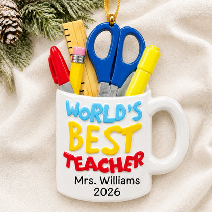 Personalized World's Best Teacher mug Christmas ornament shown on a soft white blanket