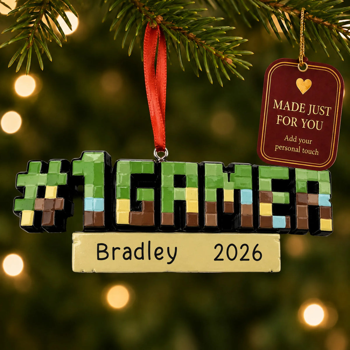 Pixel block gamer christmas ornament hanging on a lit Christmas tree with a Made Just For You gift tag