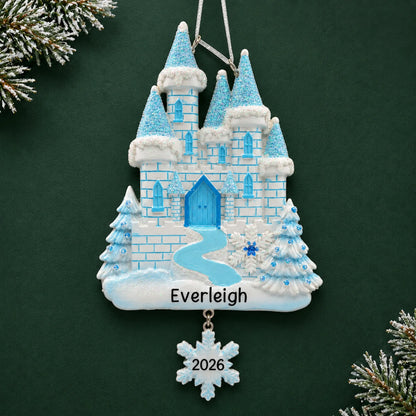 Personalized ice castle christmas ornament on a dark green pine background
