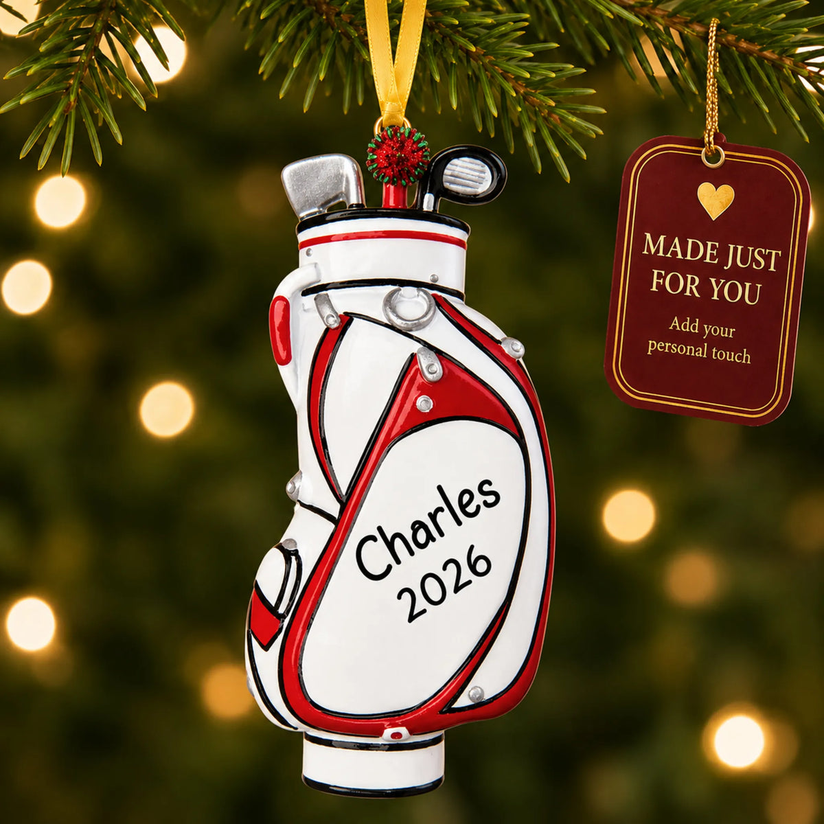 White golf bag christmas ornament hanging on a lit Christmas tree with a Made Just For You gift tag