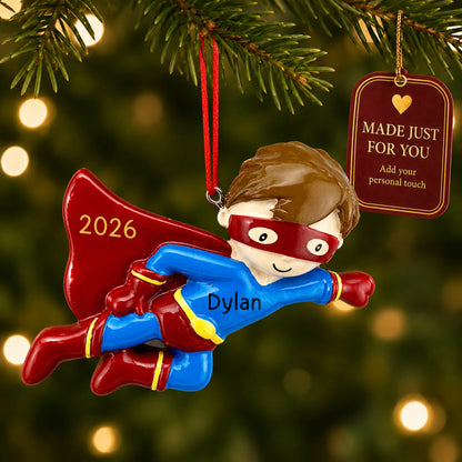 Super hero christmas ornament hanging on a lit Christmas tree with a Made Just For You gift tag