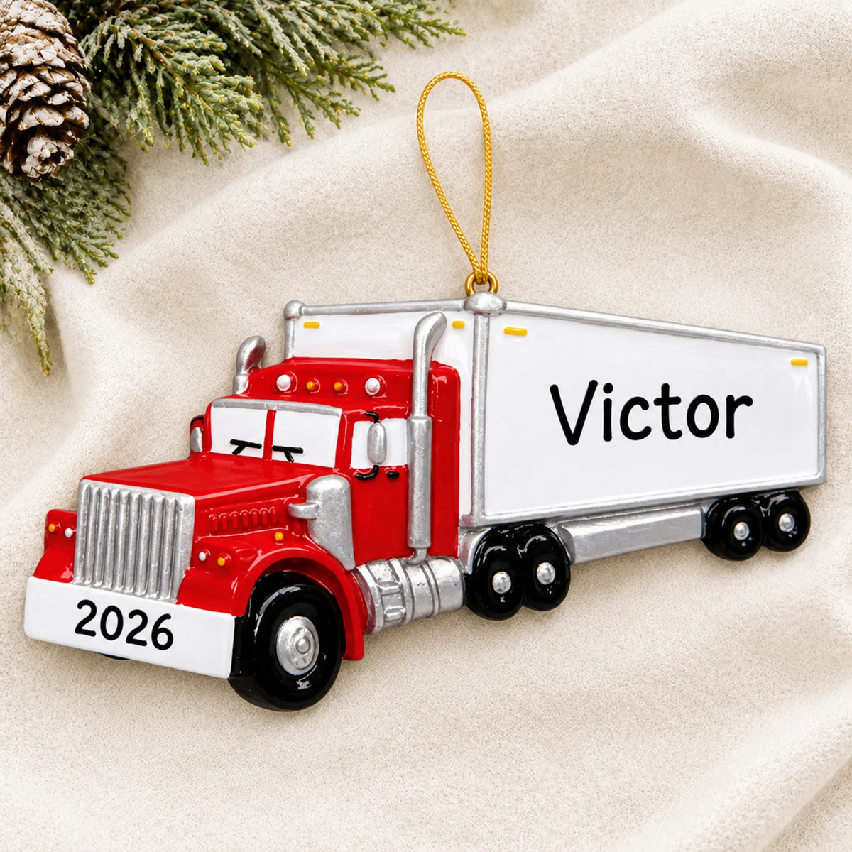 Personalized semi truck driver christmas ornament laid on a soft white knit blanket