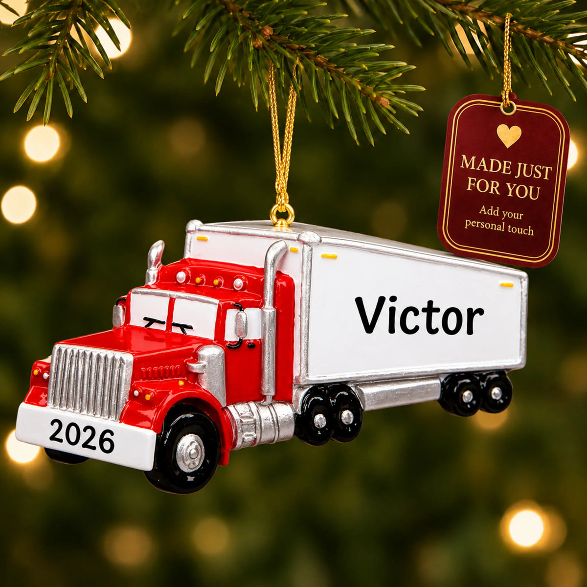 Semi truck driver christmas ornament hanging on a lit Christmas tree with a Made Just For You gift tag